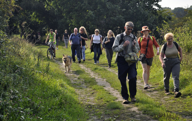 Walkers on old railway Combe Haven Valley - route of proposed bypass by jimkillock